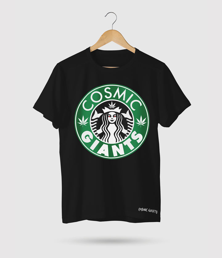 Cosmic Giants Wake n Bake T-Shirt, available in white or black. This eye-catching t-shirt features a logo on the front, showcasing our unique design. Made from 100% cotton, it offers a classic relaxed fit that is perfect for everyday wear, providing both comfort and style. But there's more to this t-shirt than meets the eye. It draws inspiration from the beloved ritual of "wake and bake" – the act or practice of enjoying a smoke of marijuana immediately upon waking.